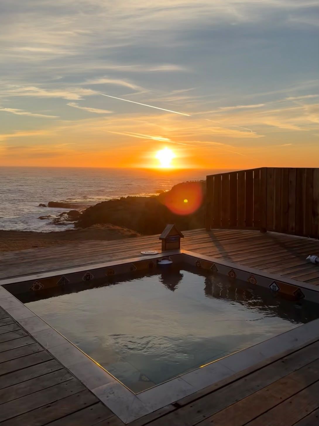 Hot tub on the deck at sunset